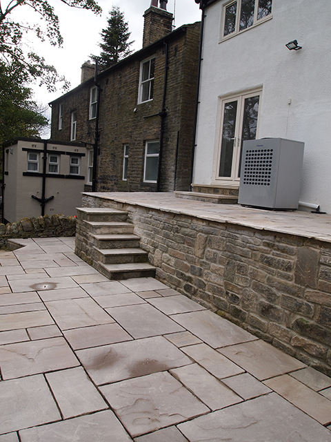general building, photo of retaining walls, patio and stone flags